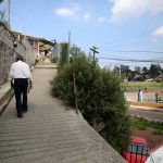 Julian walks up the walkway leading to his family's house. The house has been in the family since his mother fled to Tenancingo from the Mexican Revolution in 1909.