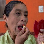 Esther’s lipstick will perfectly match the color of the trim on her folk dance costume for her performance.